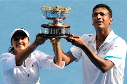 India's Sania Mirza & Mahesh Bhupathi hold  the trophy  after beating  France's Nathalie Dechy & Israel's Andy Ram  in the Mixed doubles final match at the Australian Open in Melbourne, Australia, Feb 1, 2009. (AP Photo/Andrew Brownbill)