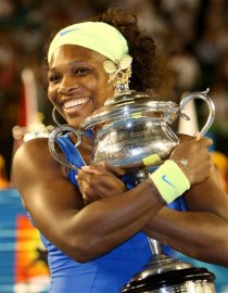 Serena Williams hugs the trophy after beating Russia's Dinara Safina in the Women's singles final match at the Australian Open in Melbourne, Jan. 31, 2009. Win is also Serena's 10th Grand Slam victory! AP Photo/Rick Stevens.